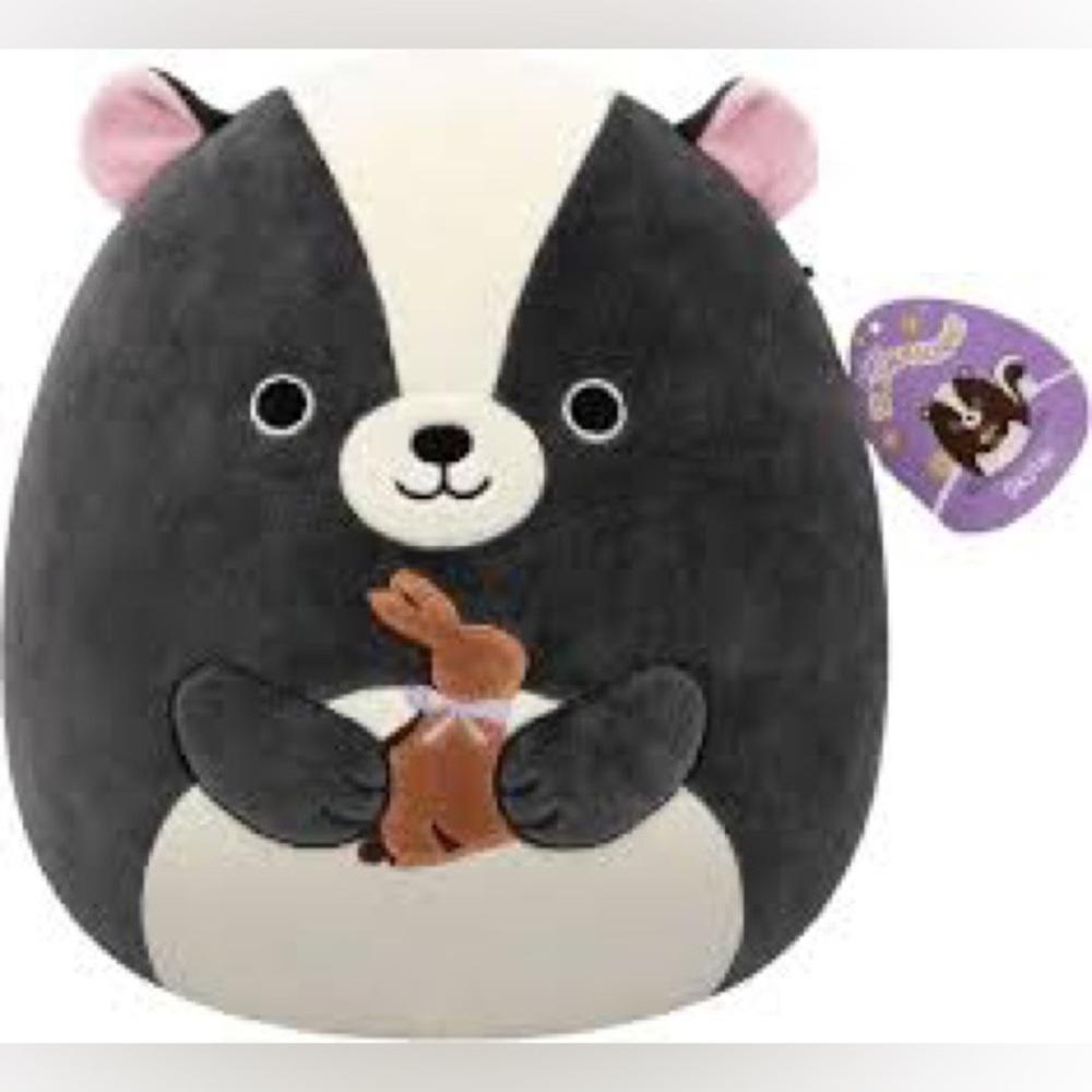 Reserved 💖 Squishmallows Skyler the Skunk plush holding a chocolate bunny